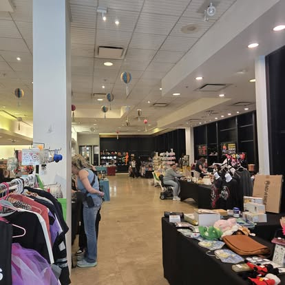 Vendor booths lining an aisle inside Yorktown Swap
